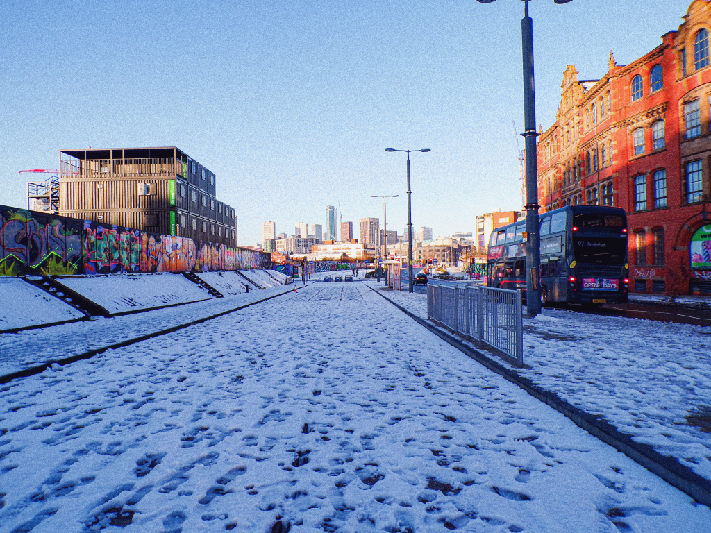 digbeth high street in the snow, with the 97 bus driving past